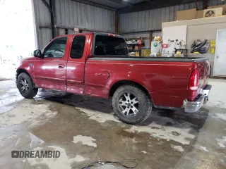 2000 Ford F-150 XL with VIN 1FTZX1720YKB22051, listed as a Copart auction lot 88255005 with 243,759 mi miles and Salvage Title. Bid and sale history available at carsss.com. Image 2.
