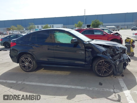 2015 BMW X4 xDrive35i with VIN 5UXXW5C50F0E87728, listed as a IAAI auction lot 41819628 with 136,042 mi miles and . Bid and sale history available at DreamBid. Image 14.