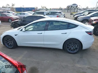 2022 Tesla Model 3 with VIN 5YJ3E1EA8NF210196, listed as a IAAI auction lot 41674407 with 24,270 mi miles. Bid and sale history available at carsss.com. Image 14.