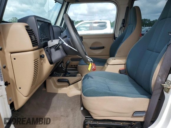 1999 Jeep Wrangler Sahara z VIN 1J4FY49S0XP432968, wystawiony jako Copart lot #65033715 z przebiegiem 126 420 mil mil oraz Szkoda całkowita • Salvage title. Historia ofert i sprzedaży dostępna na DreamBid. Obrazek 7.