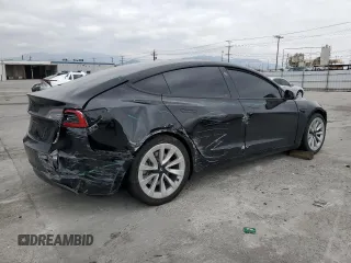 2022 Tesla Model 3 with VIN 5YJ3E1EA3NF190102, listed as a Copart auction lot 50657535 with 73,015 mi miles and Salvage Title. Bid and sale history available at DreamBid. Image 3.