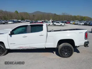 2019 GMC Canyon 4WD SLE z VIN 1GTG6CEN0K1353094, wystawiony jako IAAI lot #42065160 z przebiegiem 73 235 mil mil oraz . Historia ofert i sprzedaży dostępna na DreamBid. Obrazek 14.