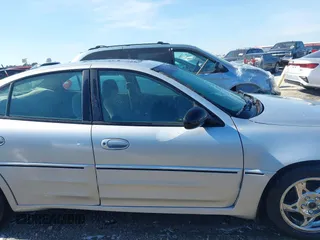 2003 Pontiac Grand Am GT with VIN 1G2NW52E13M612218, listed as a IAAI auction lot 41478495 with 242,179 mi miles. Bid and sale history available at carsss.com. Image 14.