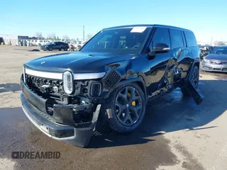 2024 Rivian R1S Adventure z VIN 7PDSGABA8RN039833, wystawiony jako IAAI lot #41867083 z przebiegiem Nie podano mil oraz . Historia ofert i sprzedaży dostępna na DreamBid. Obrazek 16.
