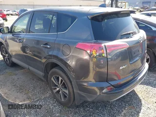 2018 Toyota RAV4 XLE with VIN JTMWFREV6JJ175575, listed as a IAAI auction lot 41788004 with 112,577 mi miles. Bid and sale history available at carsss.com. Image 3.