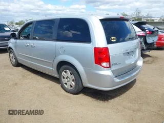 2012 Dodge Grand Caravan SE with VIN 2C4RDGBGXCR360045, listed as a IAAI auction lot 42068008 with 146,907 mi miles and . Bid and sale history available at DreamBid. Image 3.