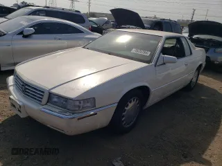 2000 Cadillac Eldorado z VIN 1G6EL12Y2YU179560, wystawiony jako Copart lot #70635784 z przebiegiem 92 959 mil mil oraz Tytuł czysty. Historia ofert i sprzedaży dostępna na DreamBid. Obrazek 1.