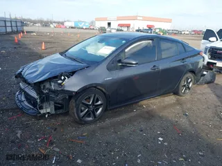 2021 Toyota Prius L Eco with VIN JTDKAMFU1M3149965, listed as a IAAI auction lot 38641916 with 69,942 mi miles. Bid and sale history available at carsss.com. Image 18.