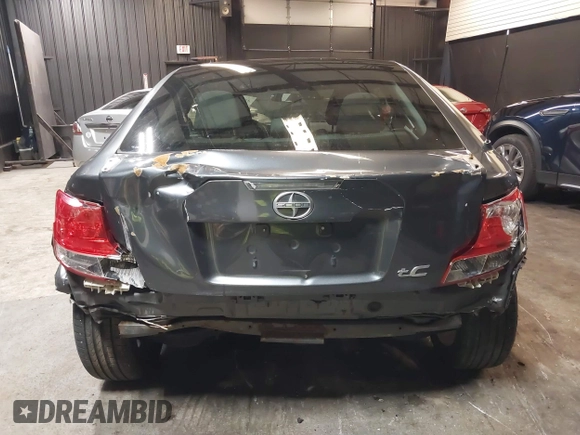 2012 Scion tC with VIN JTKJF5C7XC3034998, listed as a IAAI auction lot 41591632 with 171,121 mi miles. Bid and sale history available at carsss.com. Image 16.