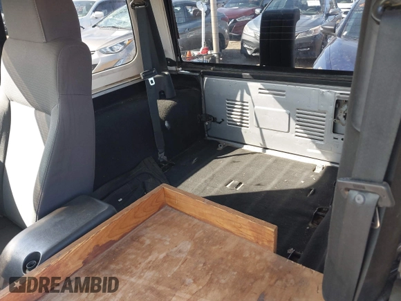 2004 Jeep Wrangler Sport Right Hand Drive with VIN 1J4F449SX4P780560, listed as a IAAI auction lot 41645721 with 146,681 mi miles. Bid and sale history available at carsss.com. Image 8.