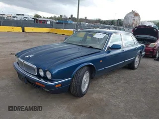 1996 Jaguar XJ with VIN SAJHX1743TC759842, listed as a IAAI auction lot 41778155 with 189,315 mi miles and . Bid and sale history available at DreamBid. Image 2.