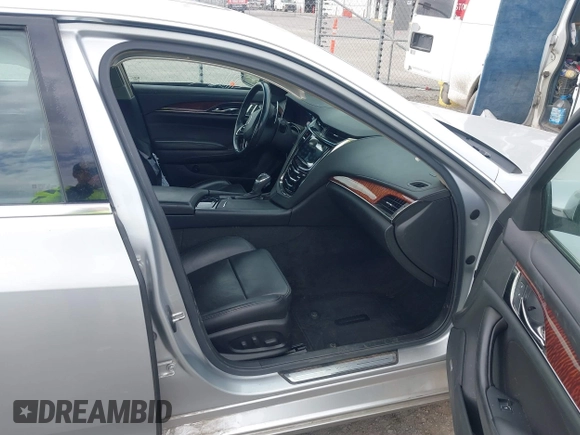 2014 Cadillac CTS Luxury AWD z VIN 1G6AX5SX2E0196881, wystawiony jako IAAI lot #41707633 z przebiegiem 169 168 mil mil oraz . Historia ofert i sprzedaży dostępna na DreamBid. Obrazek 5.