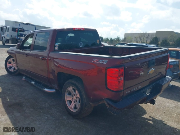 2016 Chevrolet Silverado 1500 LT with VIN 3GCUKREC0GG354271, listed as a IAAI auction lot 38948207 with 130,369 mi miles. Bid and sale history available at carsss.com. Image 3.