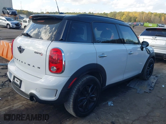 2015 MINI Countryman S with VIN WMWZC3C5XFWT06360, listed as a IAAI auction lot 40774863 with 127,383 mi miles and . Bid and sale history available at DreamBid. Image 4.