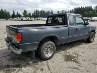 1994 Mazda B-Series Truck LE z VIN 4F4CR16X7RTM18152, wystawiony jako Copart lot #56992165 z przebiegiem 238 802 mil mil oraz Szkody całkowita. Historia ofert i sprzedaży dostępna na DreamBid. Obrazek 3.
