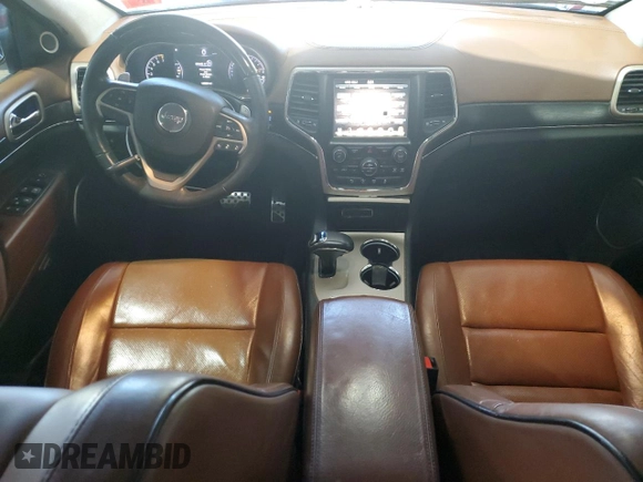 2015 Jeep Grand Cherokee Summit with VIN 1C4RJFJG1FC226591, listed as a Copart auction lot 52926115 with 130,803 mi miles and Salvage Title. Bid and sale history available at DreamBid. Image 8.