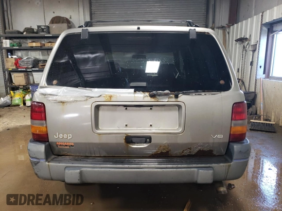 1997 Jeep Grand Cherokee Laredo with VIN 1J4GZ58Y7VC650813, listed as a Copart auction lot 41486724 with 266,004 mi miles and Salvage Title. Bid and sale history available at carsss.com. Image 6.