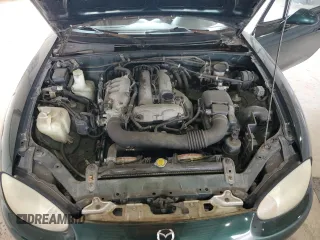 1999 Mazda MX-5 Miata z VIN JM1NB353XX0111850, wystawiony jako Copart lot #53076805 z przebiegiem 128 707 mil mil oraz Szkoda całkowita • Salvage title. Historia ofert i sprzedaży dostępna na DreamBid. Obrazek 11.