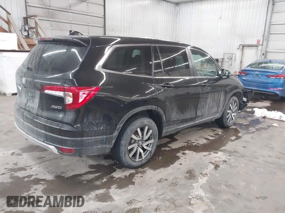 2021 Honda Pilot EX-L with VIN 5FNYF6H50MB092898, listed as a IAAI auction lot 41530673 with 28,505 mi miles. Bid and sale history available at carsss.com. Image 4.