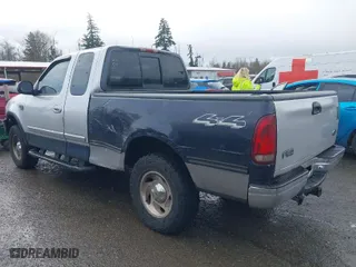 2000 Ford F-150 XL with VIN 1FTRX18L8YKA72409, listed as a IAAI auction lot 41928360 with 167,251 mi miles. Bid and sale history available at carsss.com. Image 3.