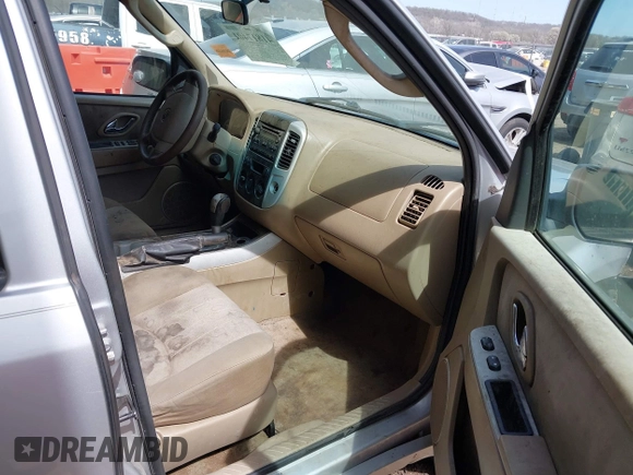 2006 Mercury Mariner Convenience with VIN 4M2YU56Z86KJ12563, listed as a IAAI auction lot 41817401 with 152,156 mi miles and . Bid and sale history available at DreamBid. Image 5.