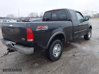 2000 Ford F-150 XL with VIN 1FTRX18LXYNA76850, listed as a IAAI auction lot 41384438 with 167,471 mi miles. Bid and sale history available at carsss.com. Image 4.