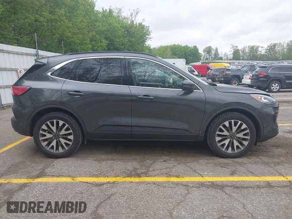 2020 Ford Escape Titanium with VIN 1FMCU9J96LUA00564, listed as a IAAI auction lot 42261152 with 73,748 mi miles and . Bid and sale history available at DreamBid. Image 13.