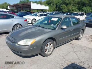 2003 Ford Taurus SE Standard z VIN 1FAFP53UX3A228383, wystawiony jako IAAI lot #42700752 z przebiegiem 182 598 mil mil oraz . Historia ofert i sprzedaży dostępna na DreamBid. Obrazek 2.