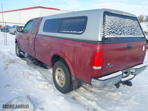 2000 Ford F-150 XL with VIN 1FTRX18WXYNC06121, listed as a IAAI auction lot 41340585 with 74,957 mi miles. Bid and sale history available at carsss.com. Image 3.