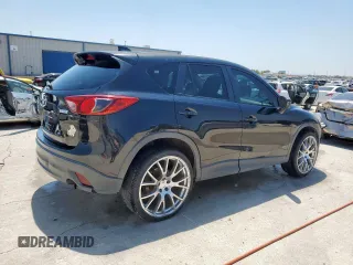 2014 Mazda CX-5 Touring with VIN JM3KE2CY5E0316077, listed as a Copart auction lot 58218735 with 190,789 mi miles and Salvage title. Bid and sale history available at DreamBid. Image 3.