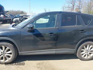2014 Mazda CX-5 Grand Touring with VIN JM3KE4DY1E0339690, listed as a IAAI auction lot 41668780 with 216,825 mi miles. Bid and sale history available at carsss.com. Image 14.