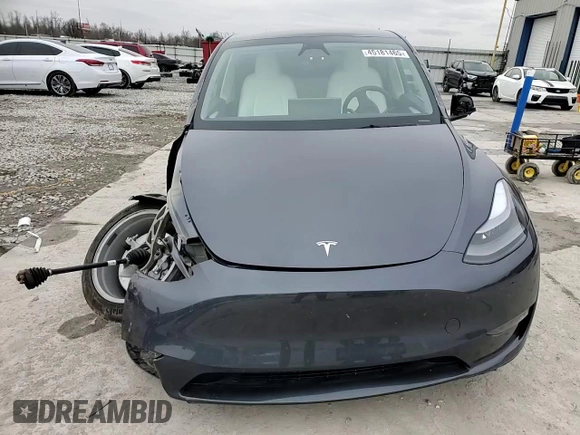 2023 Tesla Model Y Long Range z VIN 7SAYGDEE8PF884567, wystawiony jako Copart lot #45181465 z przebiegiem 16 653 mil mil oraz Szkoda całkowita • Salvage title. Historia ofert i sprzedaży dostępna na DreamBid. Obrazek 11.