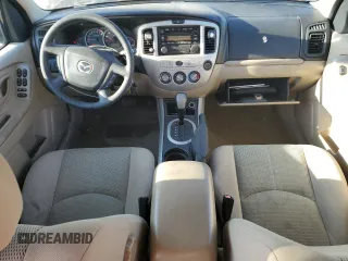2006 Mazda Tribute S with VIN 4F2YZ04116KM23873, listed as a Copart auction lot 79926084 with 67,142 mi miles and Salvage Title. Bid and sale history available at DreamBid. Image 8.