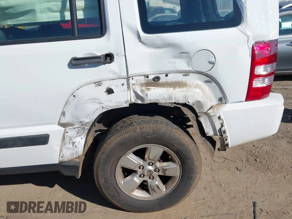 2012 Jeep Liberty Sport with VIN 1C4PJLAK7CW213834, listed as a IAAI auction lot 41353723 with 220,371 mi miles and . Bid and sale history available at DreamBid. Image 6.