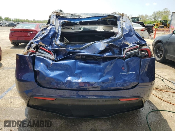 2022 Tesla Model Y Long Range z VIN 7SAYGDEE8NF447410, wystawiony jako Copart lot #54860765 z przebiegiem Nie podano mil oraz Szkody całkowita. Historia ofert i sprzedaży dostępna na DreamBid. Obrazek 6.