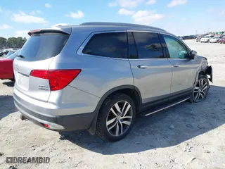 2017 Honda Pilot Touring with VIN 5FNYF6H94HB006873, listed as a IAAI auction lot 41618529 with 154,689 mi miles. Bid and sale history available at carsss.com. Image 4.