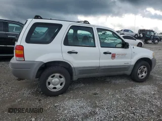 2001 Ford Escape XLS with VIN 1FMYU02161KB01283, listed as a Copart auction lot 59145105 with 86,195 mi miles and Salvage title. Bid and sale history available at DreamBid. Image 3.