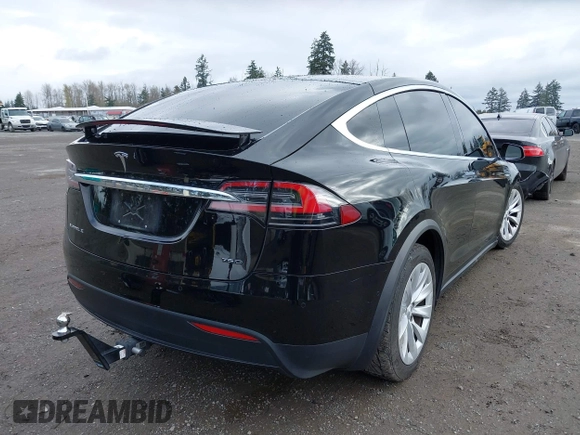 2016 Tesla Model X 70D with VIN 5YJXCBE20GF013046, listed as a IAAI auction lot 41944005 with 94,509 mi miles. Bid and sale history available at carsss.com. Image 4.