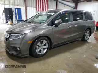 2018 Honda Odyssey EX-L z VIN 5FNRL6H77JB013494, wystawiony jako Copart lot #56348745 z przebiegiem 21 368 mil mil oraz Szkody całkowita. Historia ofert i sprzedaży dostępna na DreamBid. Obrazek 1.