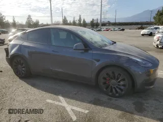 2022 Tesla Model Y Performance with VIN 7SAYGDEF3NF490643, listed as a Copart auction lot 46975825 with 50,792 mi miles and Salvage Title. Bid and sale history available at DreamBid. Image 4.