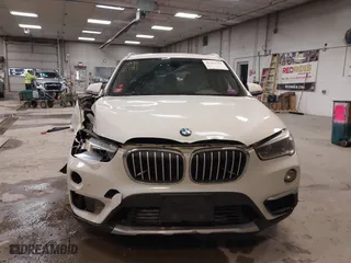 2016 BMW X1 xDrive28i with VIN WBXHT3C30G5E52065, listed as a IAAI auction lot 41552781 with 205,961 mi miles. Bid and sale history available at carsss.com. Image 11.