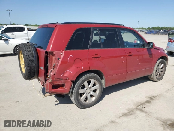 2011 Suzuki Grand Vitara Limited z VIN JS3TE0D72B4100054, wystawiony jako Copart lot #52535705 z przebiegiem 131 468 mil mil oraz Szkoda całkowita • Salvage title. Historia ofert i sprzedaży dostępna na DreamBid. Obrazek 3.
