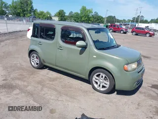 2009 Nissan Cube SL z VIN JN8AZ28R79T103005, wystawiony jako IAAI lot #42289199 z przebiegiem 135 952 mil mil oraz . Historia ofert i sprzedaży dostępna na DreamBid. Obrazek 1.