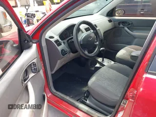 2005 Ford Focus S z VIN 1FAFP34N65W165817, wystawiony jako IAAI lot #42218809 z przebiegiem 191 324 mil mil oraz . Historia ofert i sprzedaży dostępna na DreamBid. Obrazek 12.