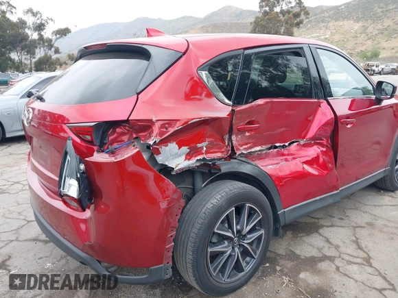 2018 Mazda CX-5 Grand Touring with VIN JM3KFADMXJ0302656, listed as a IAAI auction lot 42099173 with 125,378 mi miles and . Bid and sale history available at DreamBid. Image 6.