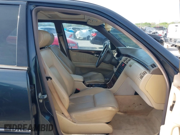 1997 Mercedes-Benz E-Class with VIN WDBJF55F7VJ027080, listed as a IAAI auction lot 42120838 with 150,197 mi miles. Bid and sale history available at carsss.com. Image 5.