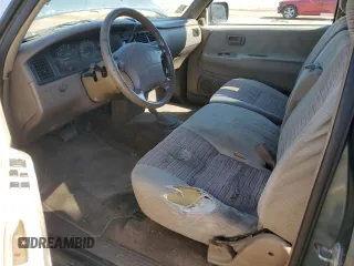 1995 Toyota T100 z VIN JT4VD22F4S0006698, wystawiony jako Copart lot #76022924 z przebiegiem 457 624 mil mil oraz Tytuł czysty. Historia ofert i sprzedaży dostępna na DreamBid. Obrazek 8.