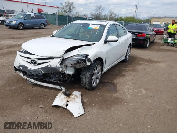 2009 Mazda 6 S Grand Touring with VIN 1YVHP82B995M09281, listed as a IAAI auction lot 42060946 with 102,423 mi miles and . Bid and sale history available at DreamBid. Image 2.