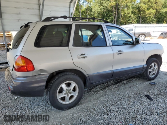 2001 Hyundai Santa Fe GLS with VIN KM8SC83D31U010136, listed as a Copart auction lot 69809604 with 79,823 mi miles and Salvage Title. Bid and sale history available at carsss.com. Image 3.