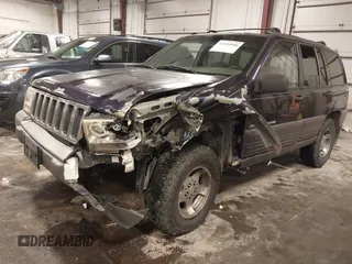 1997 Jeep Grand Cherokee Laredo with VIN 1J4GZ58S8VC675487, listed as a IAAI auction lot 41034046 with 243,284 mi miles. Bid and sale history available at carsss.com. Image 18.